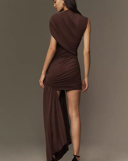 Back view of the brown ruched asymmetrical mini maxi dress, highlighting the draped back and flowing maxi skirt detail.