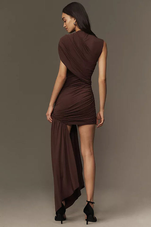 Back view of the brown ruched asymmetrical mini maxi dress, highlighting the draped back and flowing maxi skirt detail.
