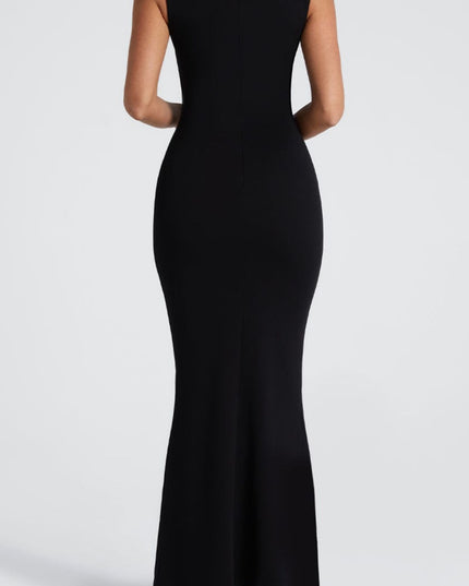 Back view of the black maxi dress, showcasing the smooth, form-fitting silhouette and subtle flare at the hem.