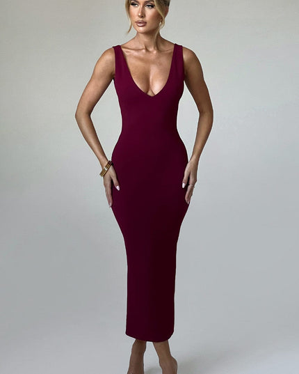 Front view of a women's burgundy plunge neck midi dress, sleeveless and form-fitting, with gold bracelet details.