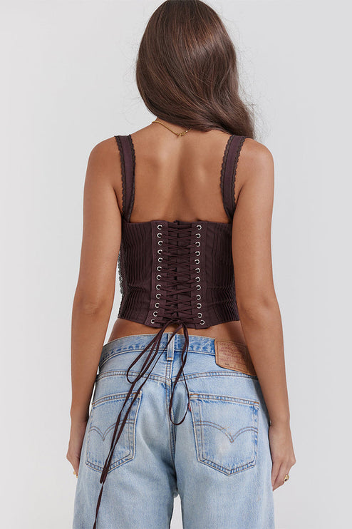 Back view of a dark brown bustier lace-up corset crop top, clearly displaying the intricate lacing from top to bottom with ties hanging down.