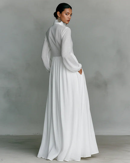 Back view of a white women's stand collar jumpsuit with long lantern sleeves and wide-leg design.