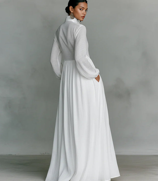 Back view of a white women's stand collar jumpsuit with long lantern sleeves and wide-leg design.