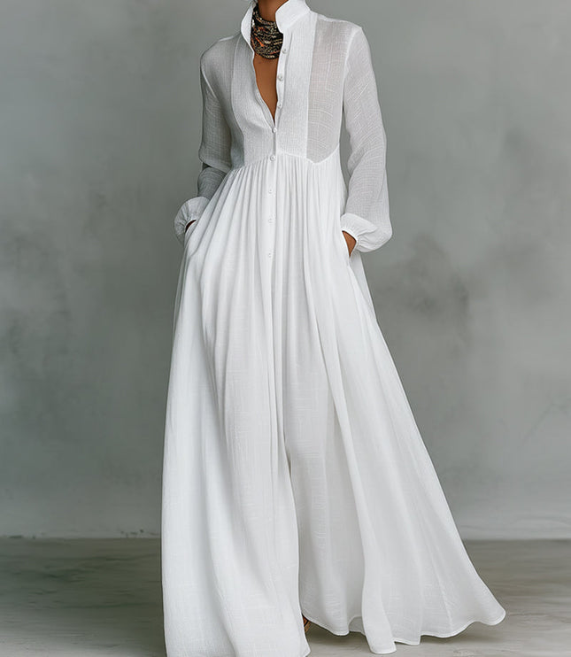 White button-down stand collar jumpsuit with lantern sleeves and wide legs, featuring gathered waist and pockets.