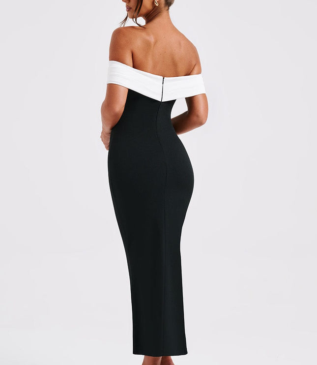 Back profile of women's black and white off-shoulder cocktail midi dress, showing the fitted design and black heels.