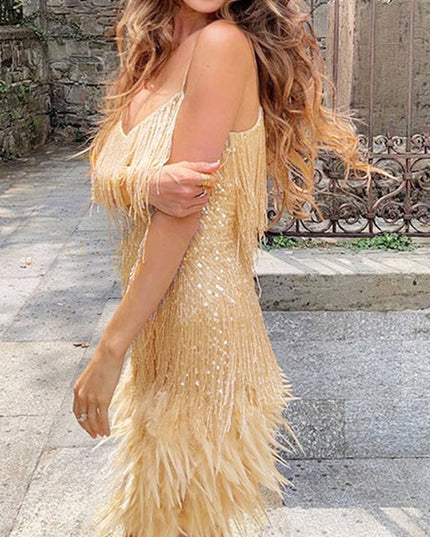 Side profile of a woman wearing a gold sequin fringe mini dress with feather trim, for a cocktail event.