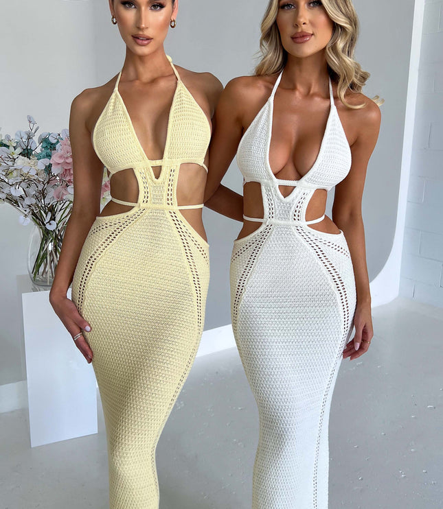 Front view of two women wearing the crochet knit maxi dress, one in light yellow and one in white, with halter necklines.