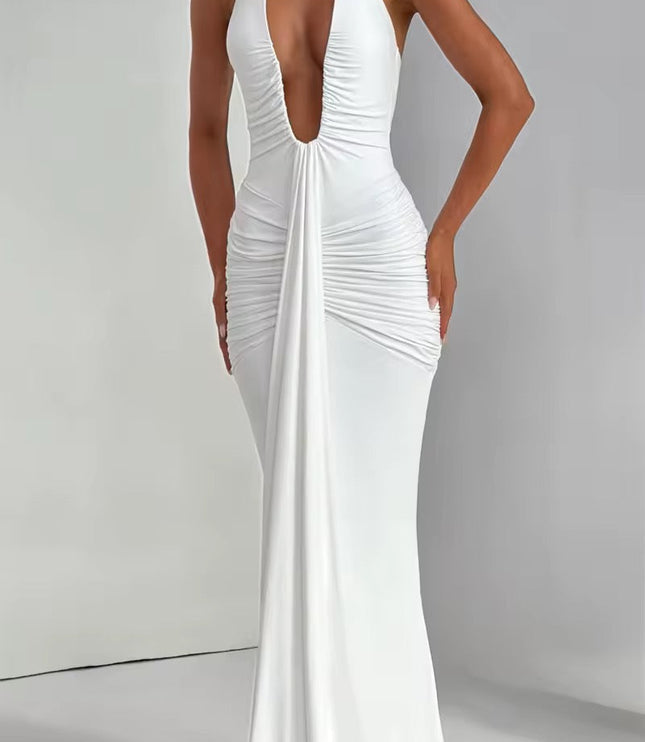 Front detail of a white deep V halter ruched mermaid maxi dress, emphasizing the deep neckline and gathered fabric.