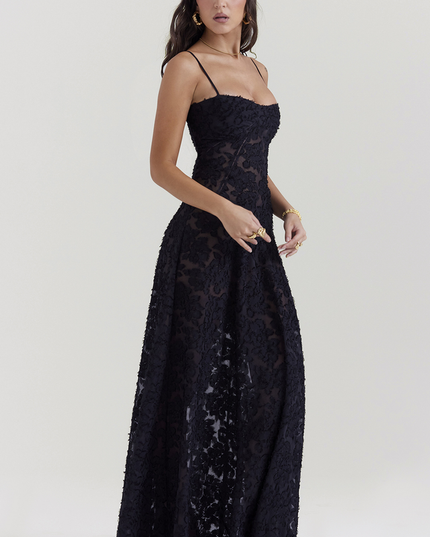 Side view of women's black floral corset maxi dress, highlighting the flowing skirt and fitted bodice.