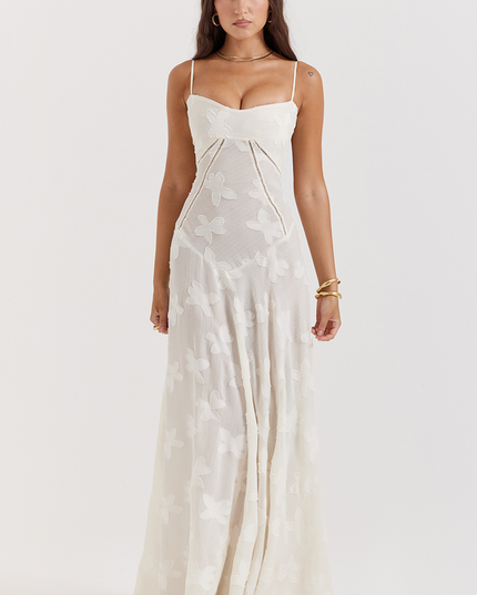 Front view of a white floral corset maxi dress with a sweetheart neckline, thin straps, and a delicate butterfly- floral pattern.