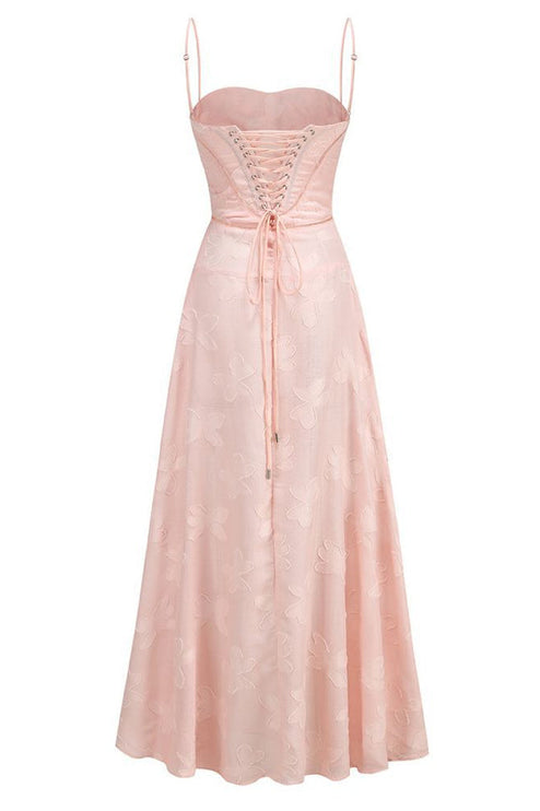 Back flat lay of a light pink floral corset maxi dress, showcasing the full lace-up detail.