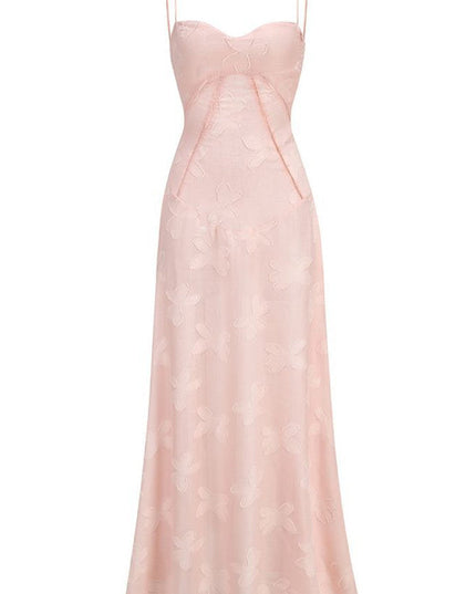 Front flat lay of a light pink floral corset maxi dress with spaghetti straps and a subtle butterfly pattern.