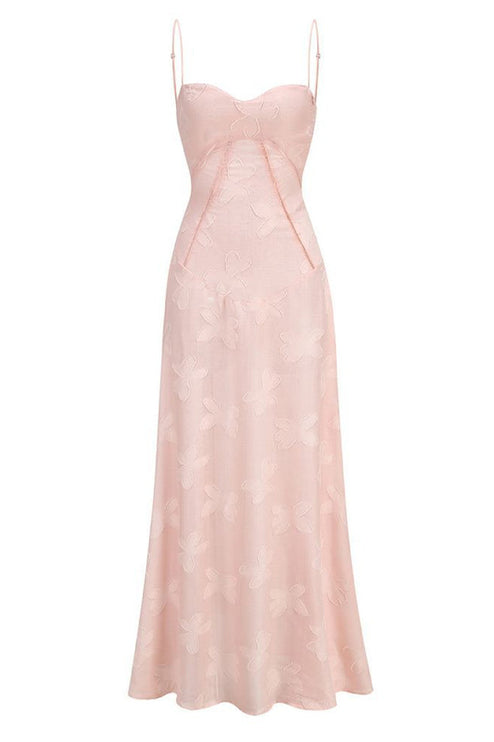 Front flat lay of a light pink floral corset maxi dress with spaghetti straps and a subtle butterfly pattern.
