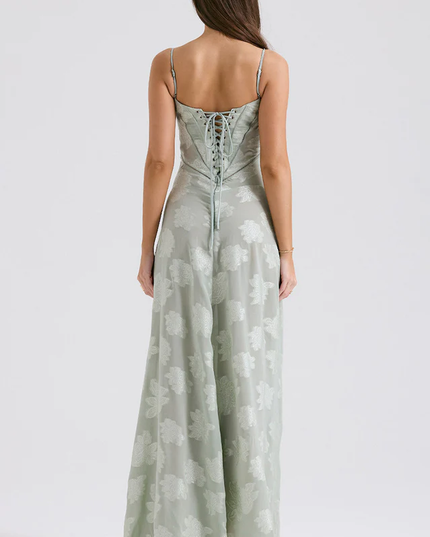 Back view of women's light sage floral corset maxi dress, showcasing the lace-up corset detail and full skirt.