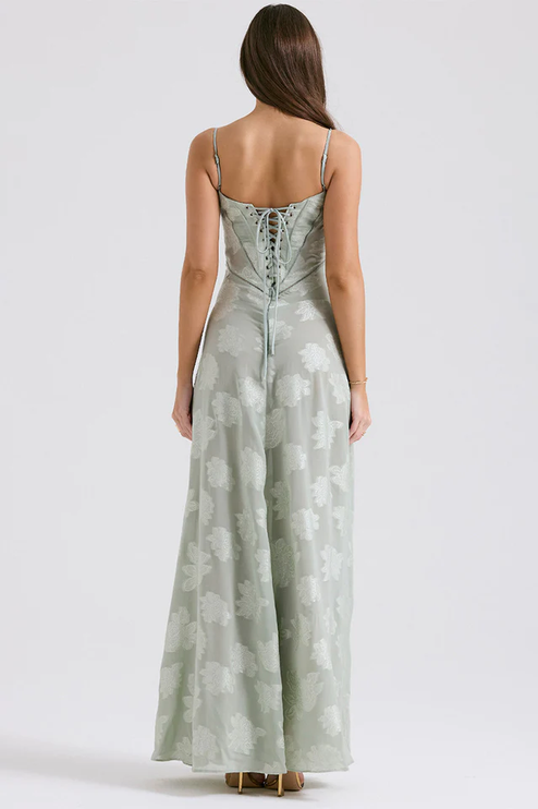 Back view of women's light sage floral corset maxi dress, showcasing the lace-up corset detail and full skirt.