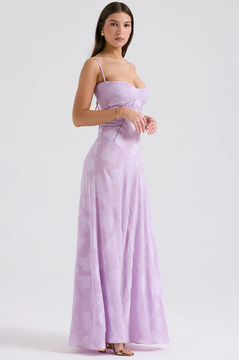 Side profile of women's lavender floral corset maxi dress, showing the elegant silhouette and thin straps.