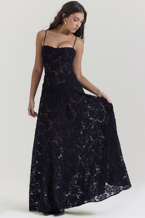Women's black floral corset maxi dress with textured floral pattern, sweetheart neckline, and thin straps.