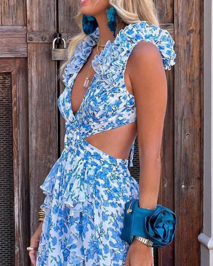 Side profile of women's blue and white floral print maxi dress, highlighting the ruffled sleeves, V-neck, and side cut-outs.