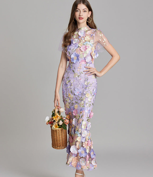 Front view of a women's lavender floral embroidered sheer maxi dress, as a prom dress or for special occasions.