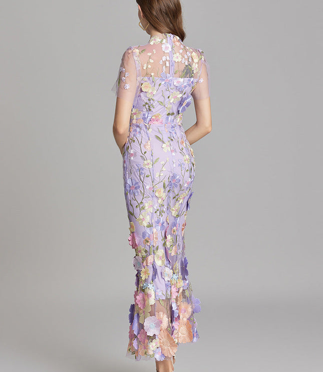 Back view of the lavender floral embroidered sheer maxi prom dress, highlighting the delicate embroidery and flowy silhouette.