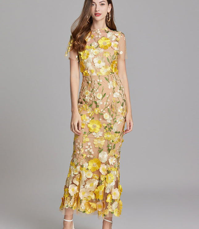 Women's yellow and white floral embroidered sheer maxi prom dress, short sleeves, with a natural stance.