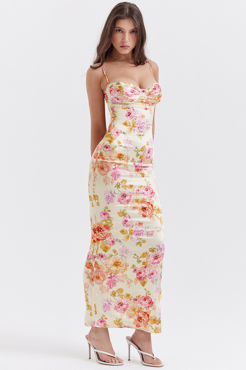 Elegant women's floral maxi dress with sweetheart neckline, subtle lace trim, and spaghetti straps, side view.
