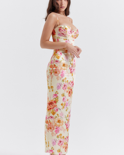 Three-quarter length view of a women's floral lace trim maxi dress, showcasing the vibrant print and fitted design.