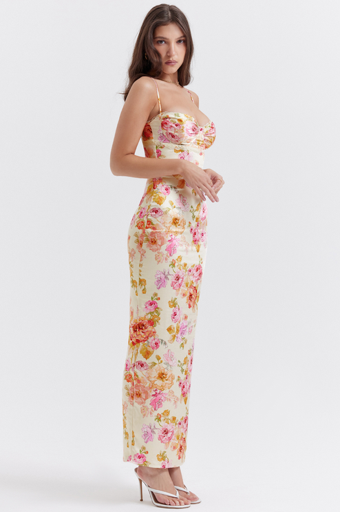 Three-quarter length view of a women's floral lace trim maxi dress, showcasing the vibrant print and fitted design.