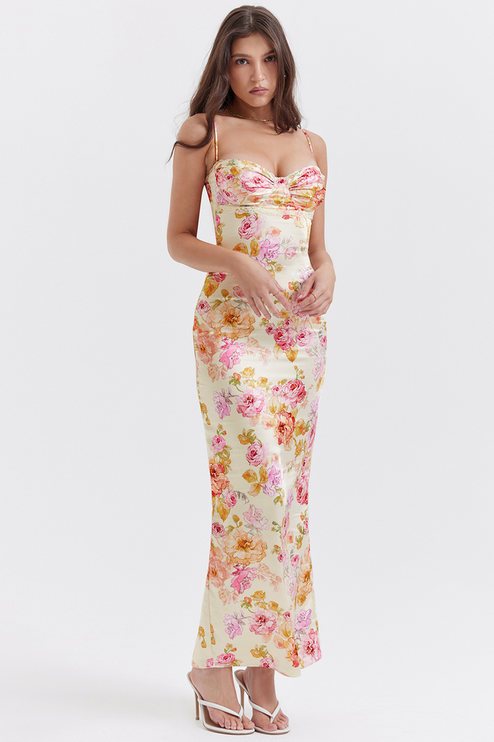 Front view of women's floral sweetheart neck maxi dress in a light yellow with pink and orange floral pattern.