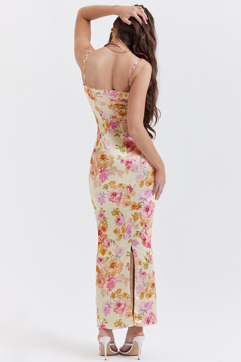 Rear view of the women's floral maxi dress, highlighting the back detail and length of the garment.