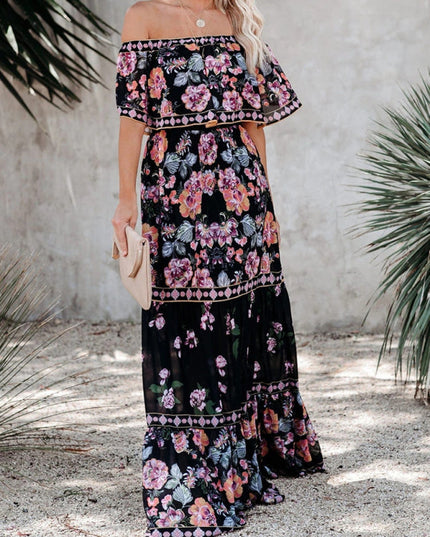 Black women's floral off-shoulder maxi dress with pink and purple blooms, tiered ruffled skirt, and gold accents.