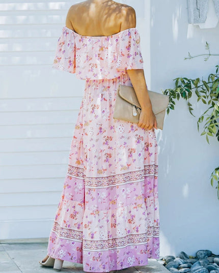 Back view of light pink floral off-shoulder ruffled maxi dress, showing the tiered skirt and pattern details.