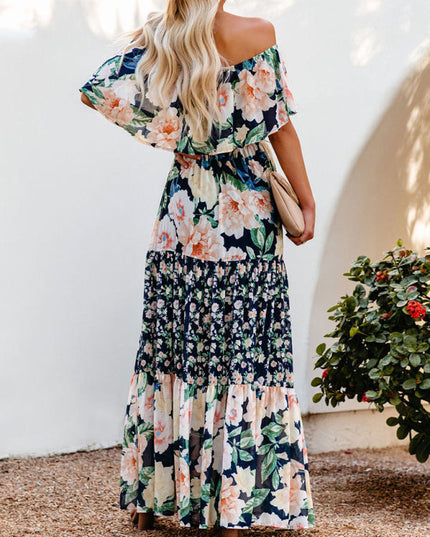 Back view of the women's off-shoulder ruffled floral maxi dress, showcasing the tiered skirt and loose-fitting top.
