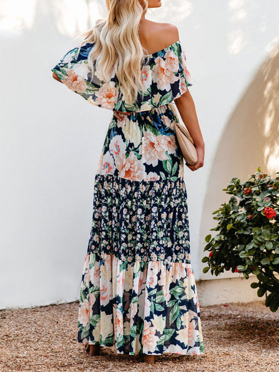 Back view of the women's off-shoulder ruffled floral maxi dress, showcasing the tiered skirt and loose-fitting top.