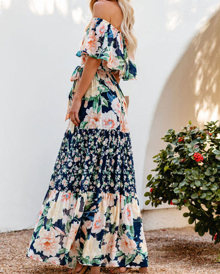 Side profile of the women's off-shoulder ruffled floral maxi dress, highlighting the tiered design and cinched waist.