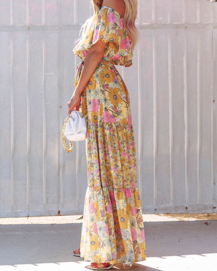 Side view of the yellow floral off-shoulder ruffled maxi dress, showing the full length and tiered skirt details.