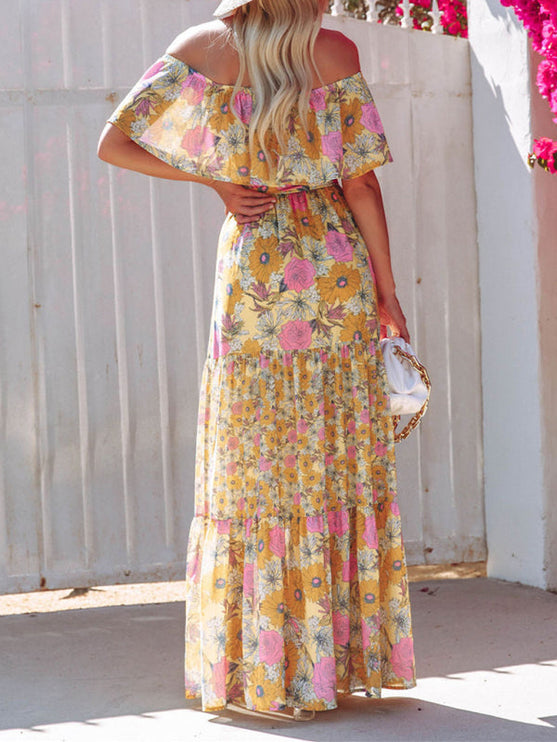 Back view of the yellow floral off-shoulder ruffled maxi dress, showcasing the vibrant sunflower print and tiered design.