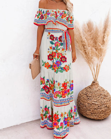 Women's white off-shoulder maxi dress with bright floral patterns and a tiered skirt, for a casual look.