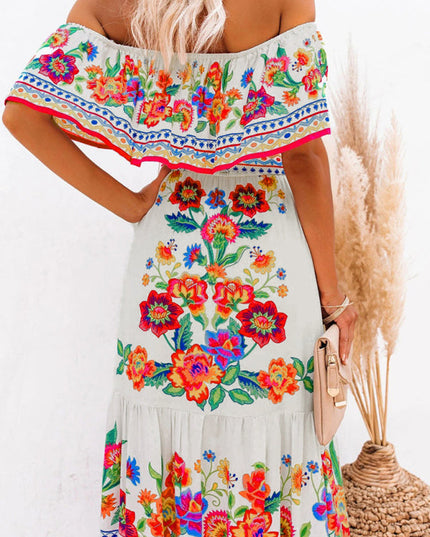Back view detail of the women's off-shoulder white floral maxi dress, showing the ruffled neckline and vibrant print.