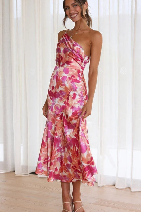 Front view of women's floral one-shoulder midi dress, vibrant pink and orange floral pattern, flowing skirt.