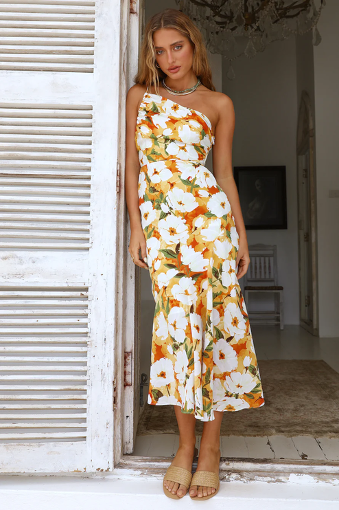 Women's floral one-shoulder midi dress, white base with vibrant orange and green floral pattern, elegant fit.