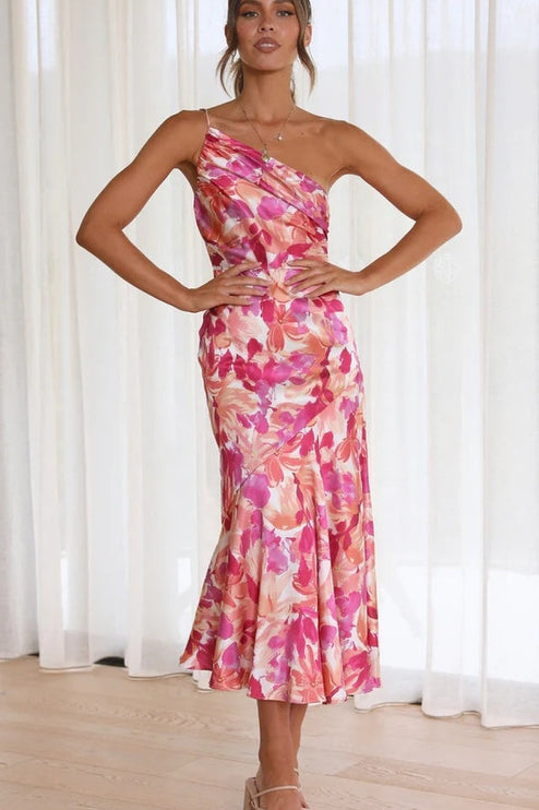 Women's floral one-shoulder midi dress in pink and fuchsia hues, ruched bust detail, elegant silhouette.
