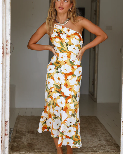 Women's floral one-shoulder midi dress with ruched bust, white with orange and yellow flowers, front view.