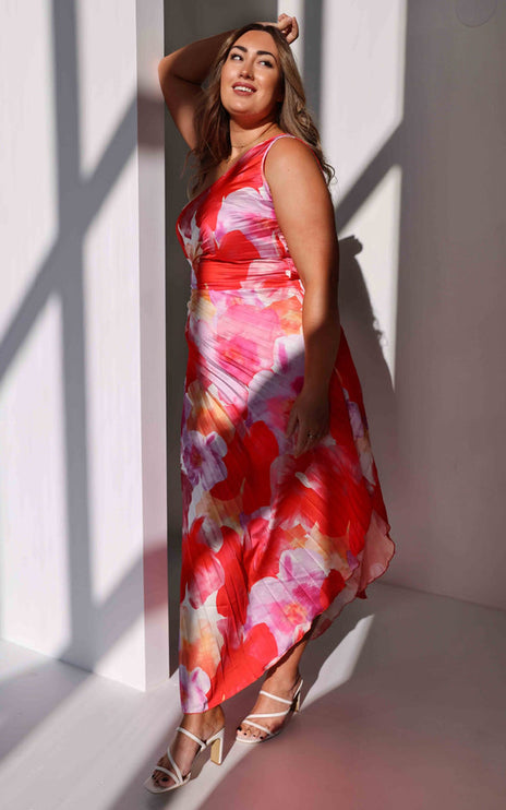 Women's floral print one-shoulder maxi dress in red and pink, with a silhouette and pleated details.