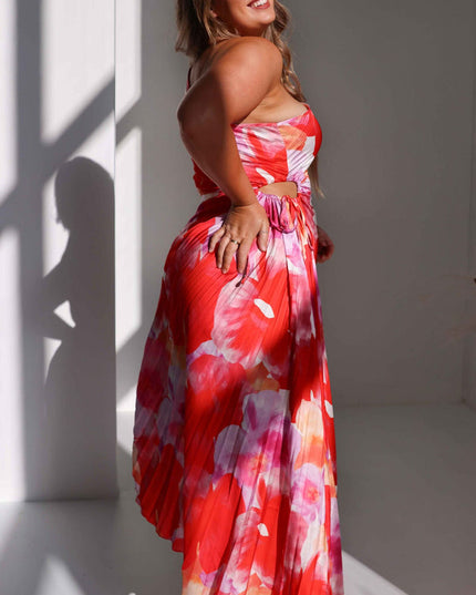 Side profile of women's floral print maxi dress, showing the one-shoulder design and subtle waist cut-out.