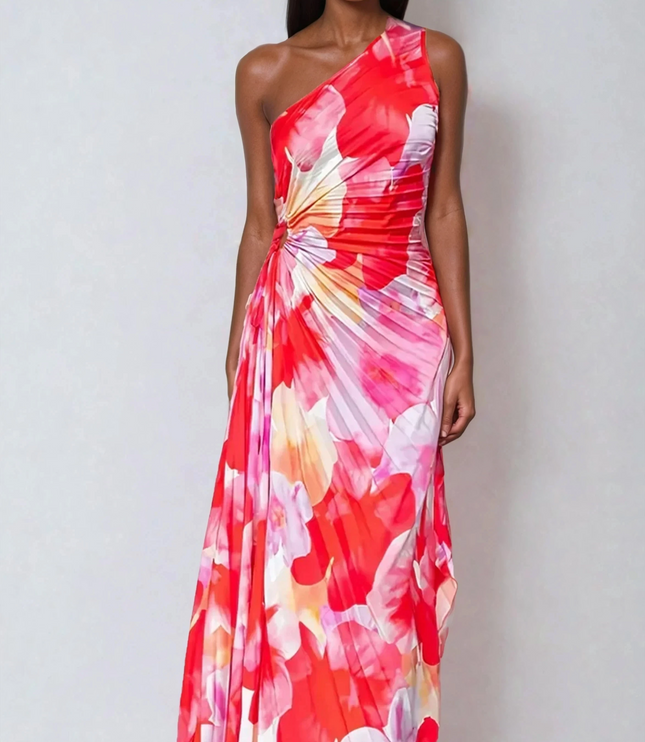 Women's vibrant red and pink floral print one-shoulder maxi dress with a ruched bodice and flowing pleated skirt.