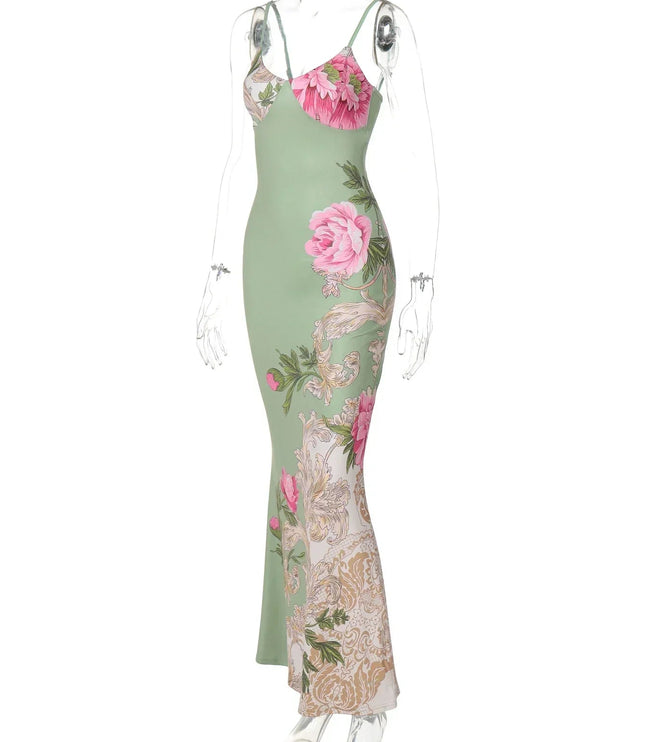 Angled view of a green floral print V-neck maxi dress with pink roses on a mannequin, white background.