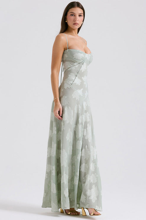 Full body side view of women's sage green floral printed sweetheart neck maxi dress with thin straps.
