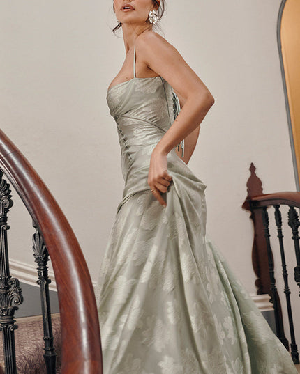 Close-up side view of women's sage green floral printed maxi dress, highlighting the fabric and details.