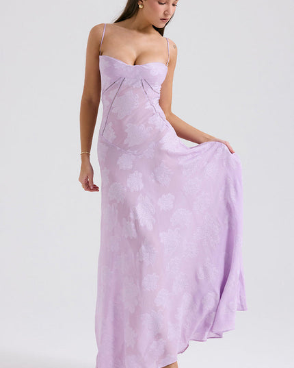 Women's light lavender floral printed maxi dress, showing the flowing skirt and sweetheart neckline, styled with gold heels.